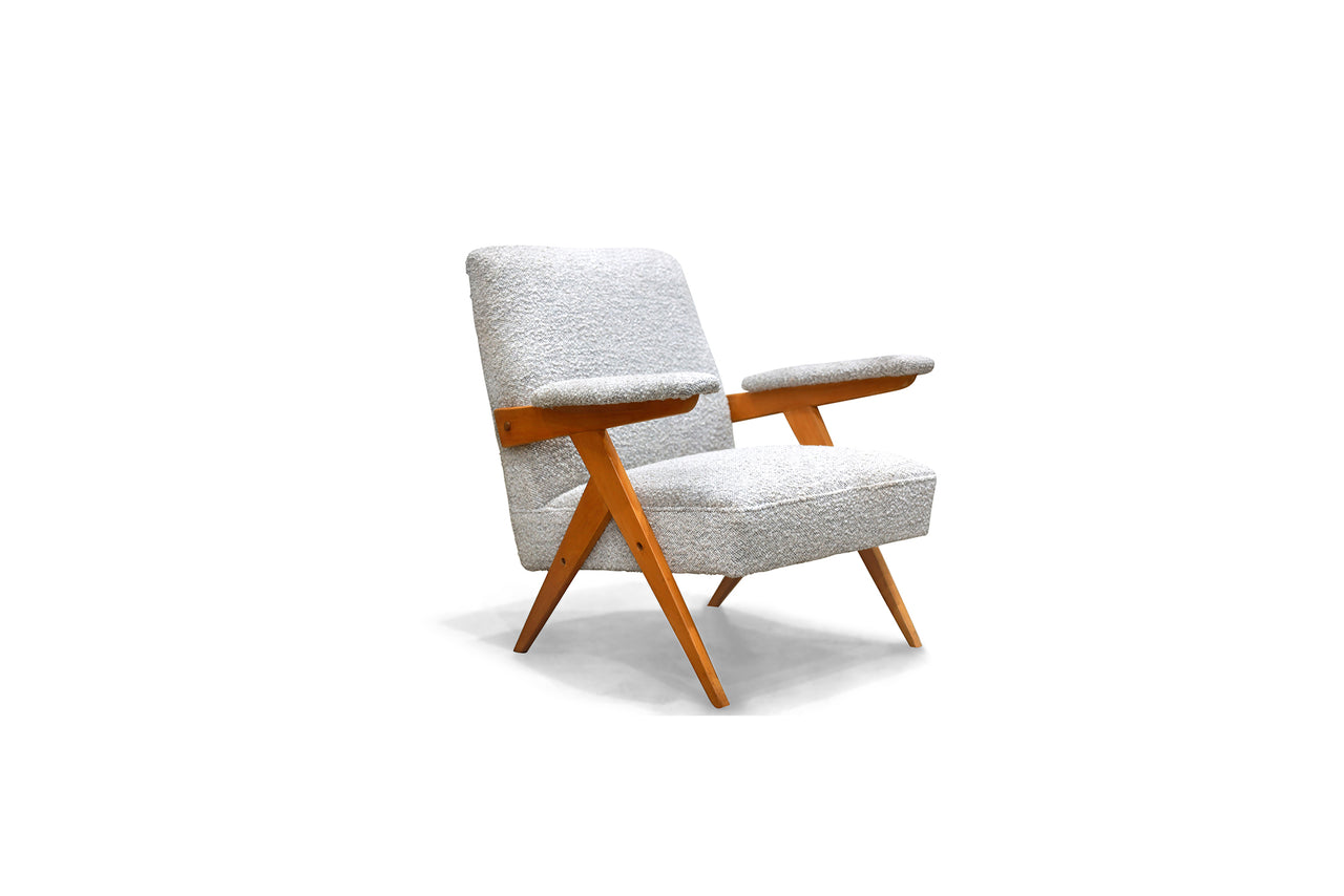 “Z” Armchair in Pau Marfim wood and boucle by Jose Zanine Caldas, c. 1950  - Lot 376